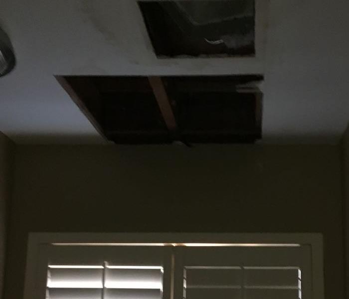 ceiling with parts removed after SERVPRO came