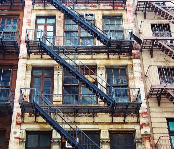 Apartment building with fire escapes on the outside